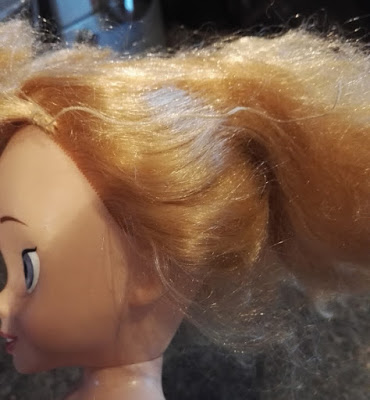fixing matted doll's hair