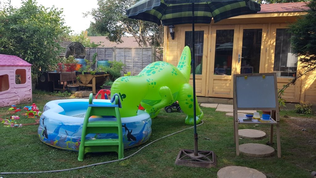 A sad dinosaur in the paddling pool