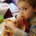 Eating spaghetti bolognese