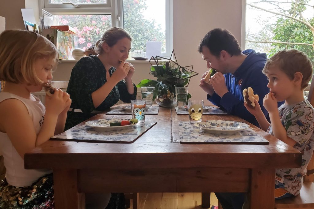 Family dinner time with burgers